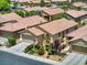 Charming one-story home showcasing desert landscaping, a well-maintained lawn, and a convenient two-car garage at 6076 Wheat Penny Ave, Las Vegas, NV 89122