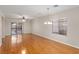 Bright living room boasts sleek wood floors, a sliding glass door, and contemporary lighting at 6076 Wheat Penny Ave, Las Vegas, NV 89122