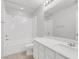 Bright, well-lit bathroom features a shower/tub combo, single vanity, and a large mirror at 6276 Desert Orchid Way, Las Vegas, NV 89141