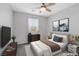 Cozy bedroom featuring a plush bed, natural light, and modern artwork and design at 6276 Desert Orchid Way, Las Vegas, NV 89141