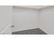 Walk-in closet featuring neutral carpeting and baseboards, shelf with rod for maximum storage at 6276 Desert Orchid Way, Las Vegas, NV 89141