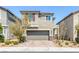 Charming two-story home featuring a spacious two-car garage and a well-manicured front yard at 6276 Desert Orchid Way, Las Vegas, NV 89141
