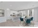 Bright kitchen featuring granite countertops, stainless steel appliances, and an adjacent dining area at 6276 Desert Orchid Way, Las Vegas, NV 89141