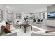 Spacious and bright open-concept living area with modern furnishings and kitchen at 6276 Desert Orchid Way, Las Vegas, NV 89141