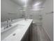 Bright bathroom with double sink vanity, tub, and modern fixtures at 629 Soaring Wings Ave, Las Vegas, NV 89183