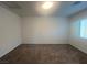 Carpeted bedroom with natural light from window; blank canvas ready for your personal touch at 629 Soaring Wings Ave, Las Vegas, NV 89183
