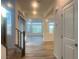 Bright entryway with hardwood flooring and staircase leading to the upper level of the home at 629 Soaring Wings Ave, Las Vegas, NV 89183