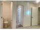 Hallway with tile floor, showing the access to a bathroom and other rooms at 629 Soaring Wings Ave, Las Vegas, NV 89183