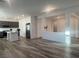 Open-concept layout with hardwood floors connecting the kitchen and living areas at 629 Soaring Wings Ave, Las Vegas, NV 89183