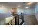 Carpeted loft area with railing and plenty of natural light from several windows at 629 Soaring Wings Ave, Las Vegas, NV 89183