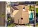 Aerial shot of a house featuring a tile roof, backyard pool, and well-maintained landscaping at 6509 Vicuna Dr, Las Vegas, NV 89146