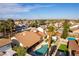 Beautiful home with a backyard oasis, pool, and covered patio with lush trees offering a picturesque skyline at 6509 Vicuna Dr, Las Vegas, NV 89146