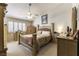 Comfortable bedroom featuring neutral carpet, a ceiling fan, and ample closet space at 6509 Vicuna Dr, Las Vegas, NV 89146