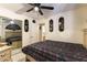 Comfortable bedroom featuring a ceiling fan and mirrored closet at 6509 Vicuna Dr, Las Vegas, NV 89146