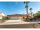 Charming single-story home featuring a spacious three-car garage and desert landscaping at 6509 Vicuna Dr, Las Vegas, NV 89146