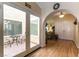Inviting home foyer with wood floors that flow into the dining area and large sliding glass door to a patio at 6509 Vicuna Dr, Las Vegas, NV 89146