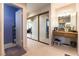 Hallway leading to rooms, featuring mirrored closet doors and built in make-up vanity at 6509 Vicuna Dr, Las Vegas, NV 89146