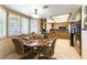 Eat-in kitchen with stainless appliances, neutral countertops, tile flooring, and natural light at 6509 Vicuna Dr, Las Vegas, NV 89146