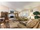 Cozy living room features a white-brick fireplace, vaulted ceilings and plenty of natural light at 6509 Vicuna Dr, Las Vegas, NV 89146