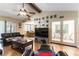 Relaxing living room with hardwood floors, vaulted ceiling, and rear patio access at 6509 Vicuna Dr, Las Vegas, NV 89146