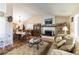 Inviting living room with a white-brick fireplace, vaulted ceilings and an open floor plan at 6509 Vicuna Dr, Las Vegas, NV 89146