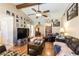 Bright living room showcasing hardwood floors, vaulted ceilings, and access to the rear of the home at 6509 Vicuna Dr, Las Vegas, NV 89146