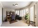 This home office has natural light, built-in storage, and doors leading to a private outdoor space at 6509 Vicuna Dr, Las Vegas, NV 89146