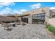Charming backyard with a patio, fire pit, and scenic views at 658 Falcon Summit Ct, Henderson, NV 89012