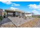 Stunning backyard featuring an outdoor kitchen, large patio, and breathtaking views at 658 Falcon Summit Ct, Henderson, NV 89012
