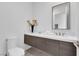 Stylish powder room with a floating vanity, contemporary fixtures, and elegant decor, perfect for guests and everyday convenience at 658 Falcon Summit Ct, Henderson, NV 89012