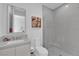 Modern bathroom with a sleek vanity, toilet, and glass-enclosed shower at 658 Falcon Summit Ct, Henderson, NV 89012