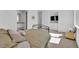 Bright bedroom featuring minimalist decor, neutral tones, and an adjacent bathroom, offering a serene and modern living space at 658 Falcon Summit Ct, Henderson, NV 89012