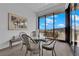 Bright dining area features a glass table set with neighborhood views at 658 Falcon Summit Ct, Henderson, NV 89012
