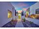 Modern home entry features desert landscaping, brick walkway and contemporary architecture at 658 Falcon Summit Ct, Henderson, NV 89012