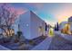 Modern home exterior features desert landscaping, brick walkway, and house number at 658 Falcon Summit Ct, Henderson, NV 89012