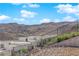 Beautiful exterior featuring modern architecture and hillside landscaping with stunning views at 658 Falcon Summit Ct, Henderson, NV 89012