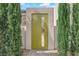 Modern home with unique front door and professionally landscaped yard at 658 Falcon Summit Ct, Henderson, NV 89012
