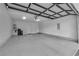 Spacious three car garage with clean epoxy floors and lighting at 658 Falcon Summit Ct, Henderson, NV 89012