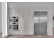 Modern kitchen featuring stainless steel double oven and refrigerator at 658 Falcon Summit Ct, Henderson, NV 89012