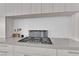 Modern kitchen featuring a cooktop in countertop and light colored cabinets at 658 Falcon Summit Ct, Henderson, NV 89012