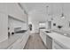 Contemporary kitchen featuring stainless steel appliances, long island and light wood floors at 658 Falcon Summit Ct, Henderson, NV 89012