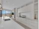 Gourmet kitchen boasting white cabinets, island, modern appliances, and stunning views at 658 Falcon Summit Ct, Henderson, NV 89012