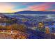 Neighborhood hillside view with desert landscaping and glowing city lights at 658 Falcon Summit Ct, Henderson, NV 89012
