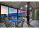Indoor outdoor living featuring city views, patio seating and open access to the kitchen at 658 Falcon Summit Ct, Henderson, NV 89012