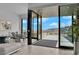 Indoor-outdoor living with mountain views from living room and covered patio at 658 Falcon Summit Ct, Henderson, NV 89012