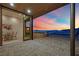 Indoor outdoor living featuring city views, patio seating, and brick patio at 658 Falcon Summit Ct, Henderson, NV 89012