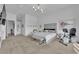 Spacious primary bedroom showcasing a cozy seating area, exercise equipment, and soothing decor for a relaxing ambiance at 658 Falcon Summit Ct, Henderson, NV 89012