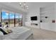 Elegant primary suite with access to a patio, built-in media center, and breathtaking views, perfect for relaxation and entertainment at 658 Falcon Summit Ct, Henderson, NV 89012