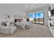 Expansive primary suite with floor-to-ceiling windows, luxurious seating, and scenic views, creating a tranquil retreat at 658 Falcon Summit Ct, Henderson, NV 89012