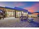 Inviting patio with fire pit, outdoor lounge area and indoor/outdoor access, perfect for entertaining at 658 Falcon Summit Ct, Henderson, NV 89012
